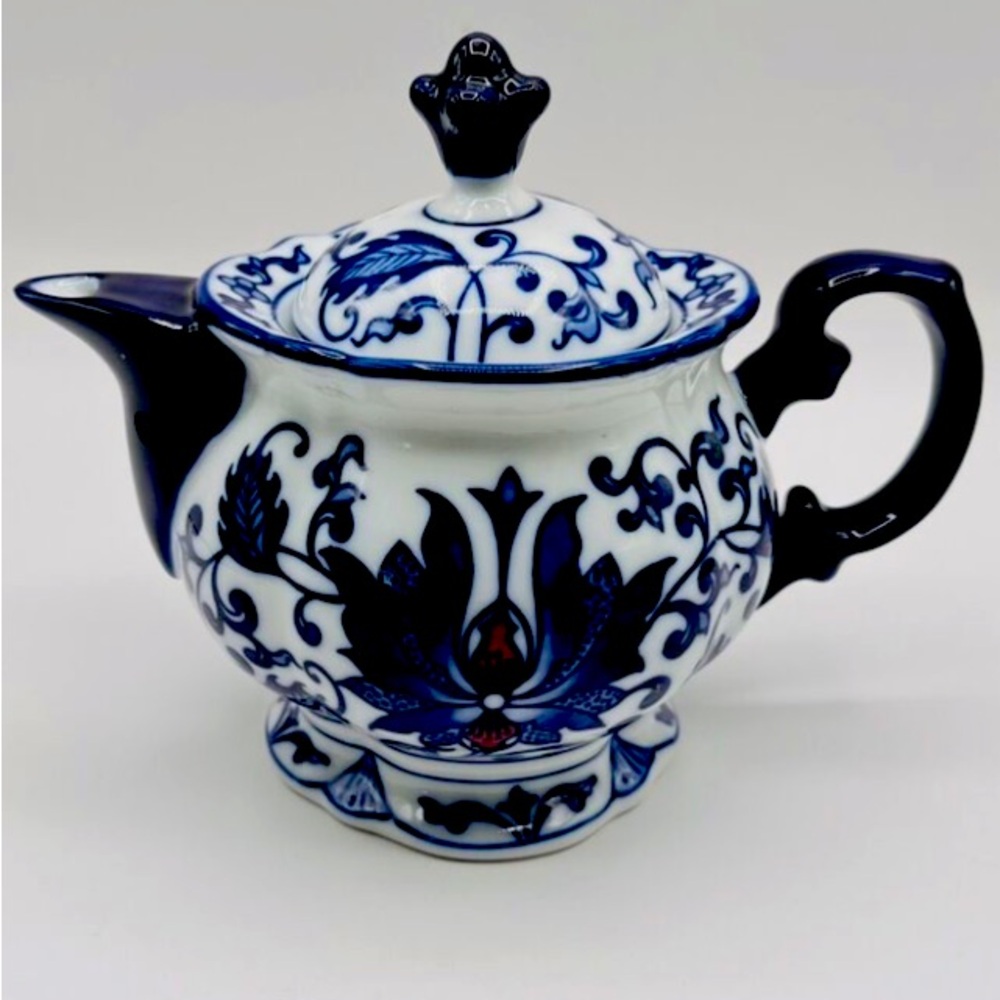 Beautiful Bombay&Co. Blue and White teapot vintage with floral print.